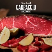 CARPACCIO DI ANGUS CON RUCOLA E GRANA